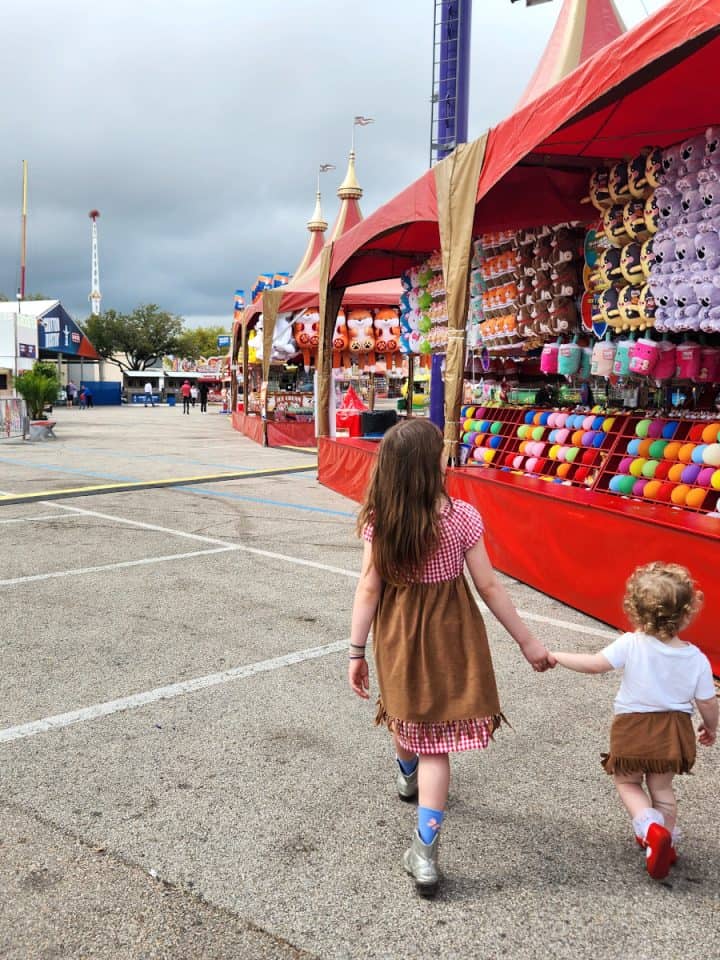 Rodeo Houston Kids Walking by Game Booths in Carnival